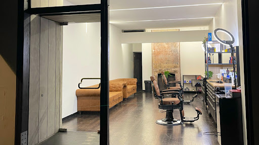 Inside Trims House Barber showing barber chairs and the waiting area